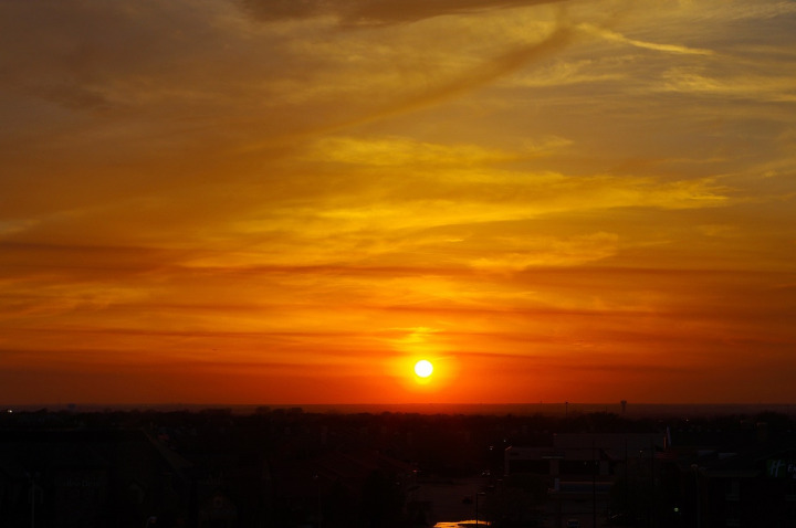 Texas sky with sun and clouds